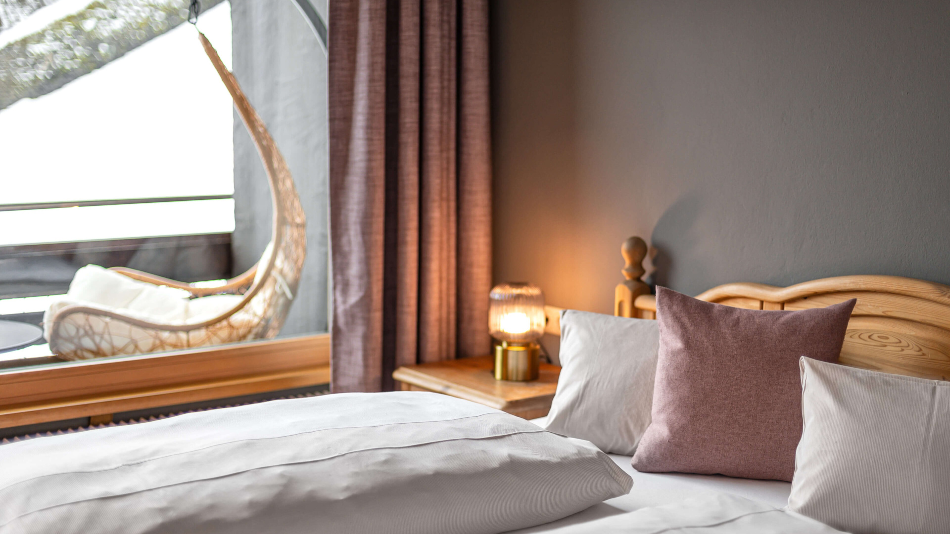 Cozy vintage-style room with a view of the snow-covered mountains in Bad Hofgastein.