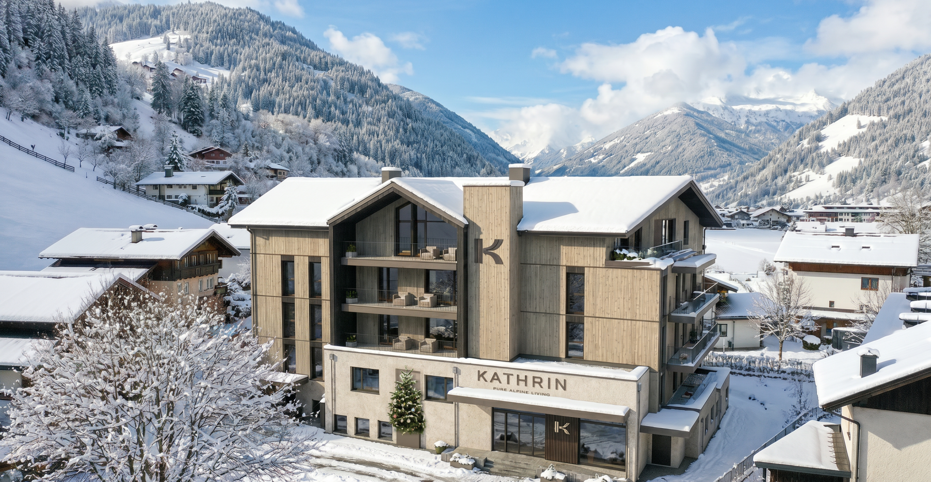 Modernes Appartementhaus Kathrin in verschneitem Alpendorf mit Bergen und Winterlandschaft